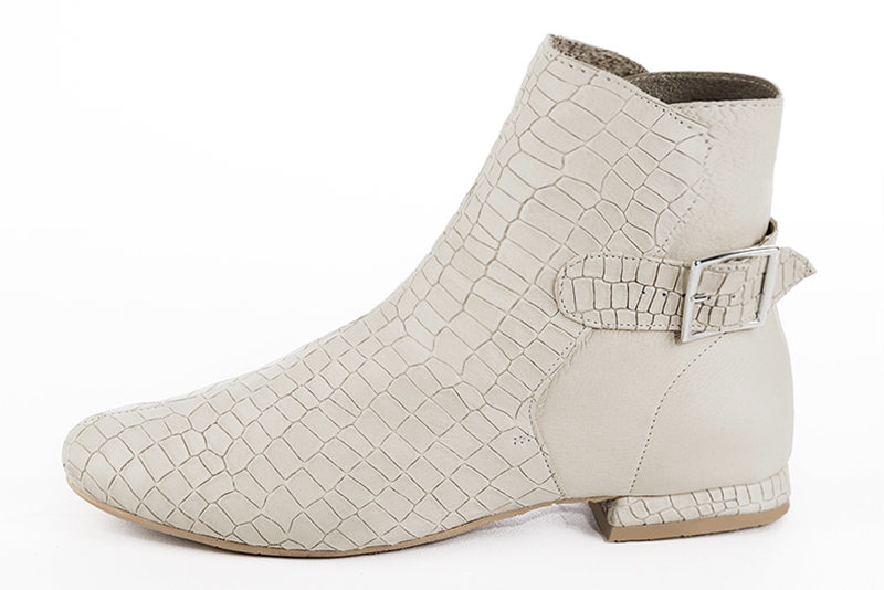 Off white women's ankle boots with buckles at the back. Round toe. Flat block heels. Profile view - Florence KOOIJMAN